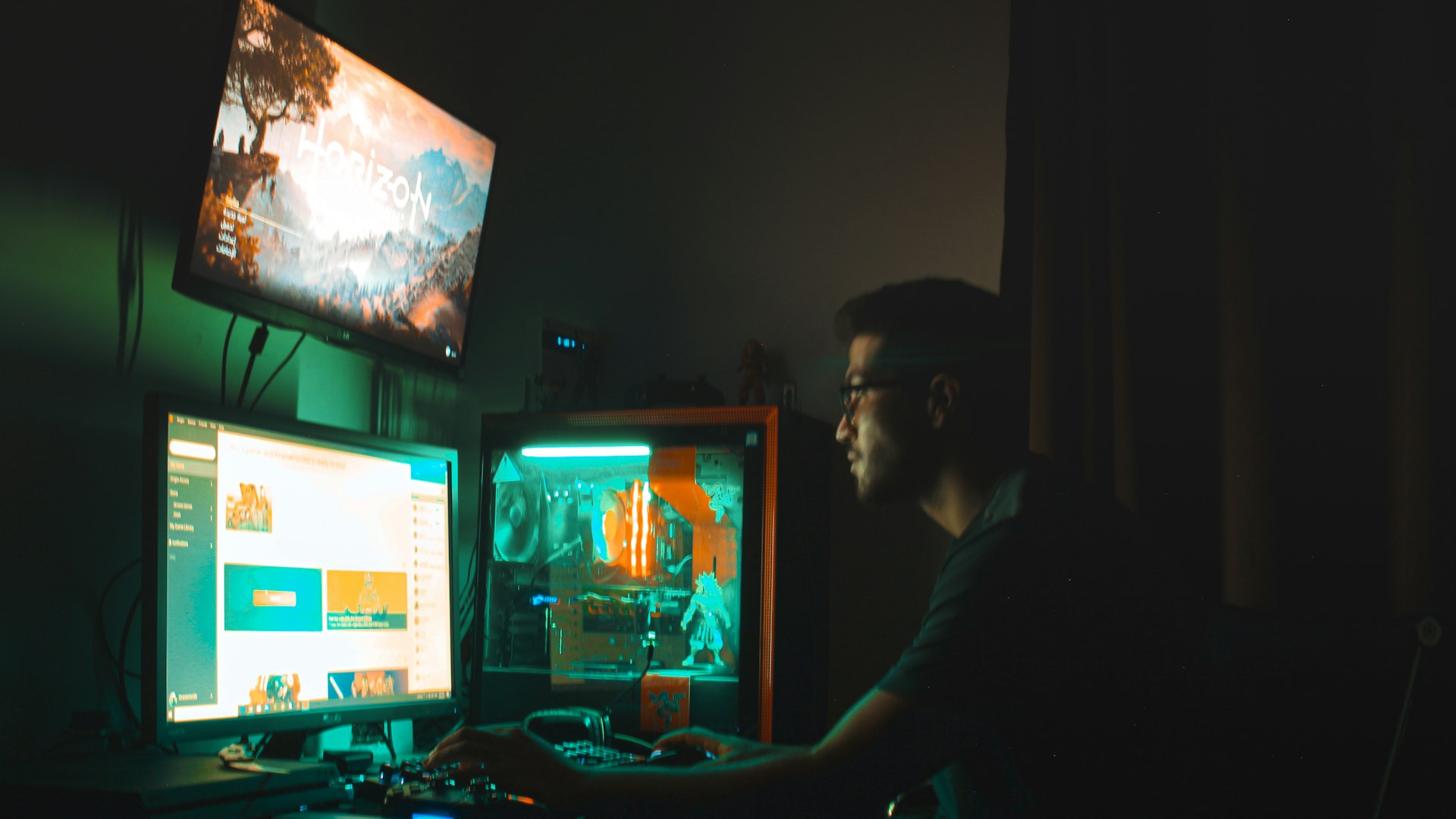 A gaming setup lit in warm tones